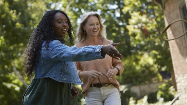 Two women outside playing Victorian garden games