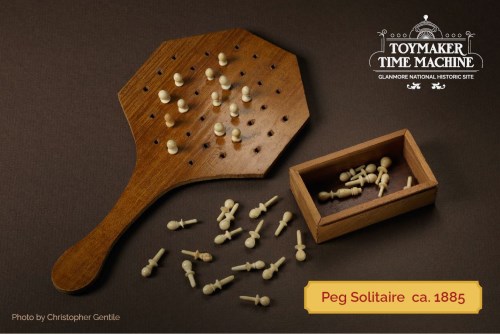Photograph of an 1885 wooden peg solitaire game