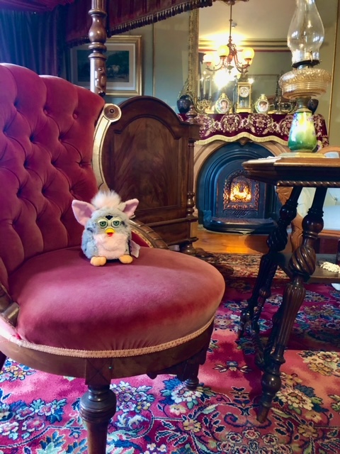 Furby on pink chair