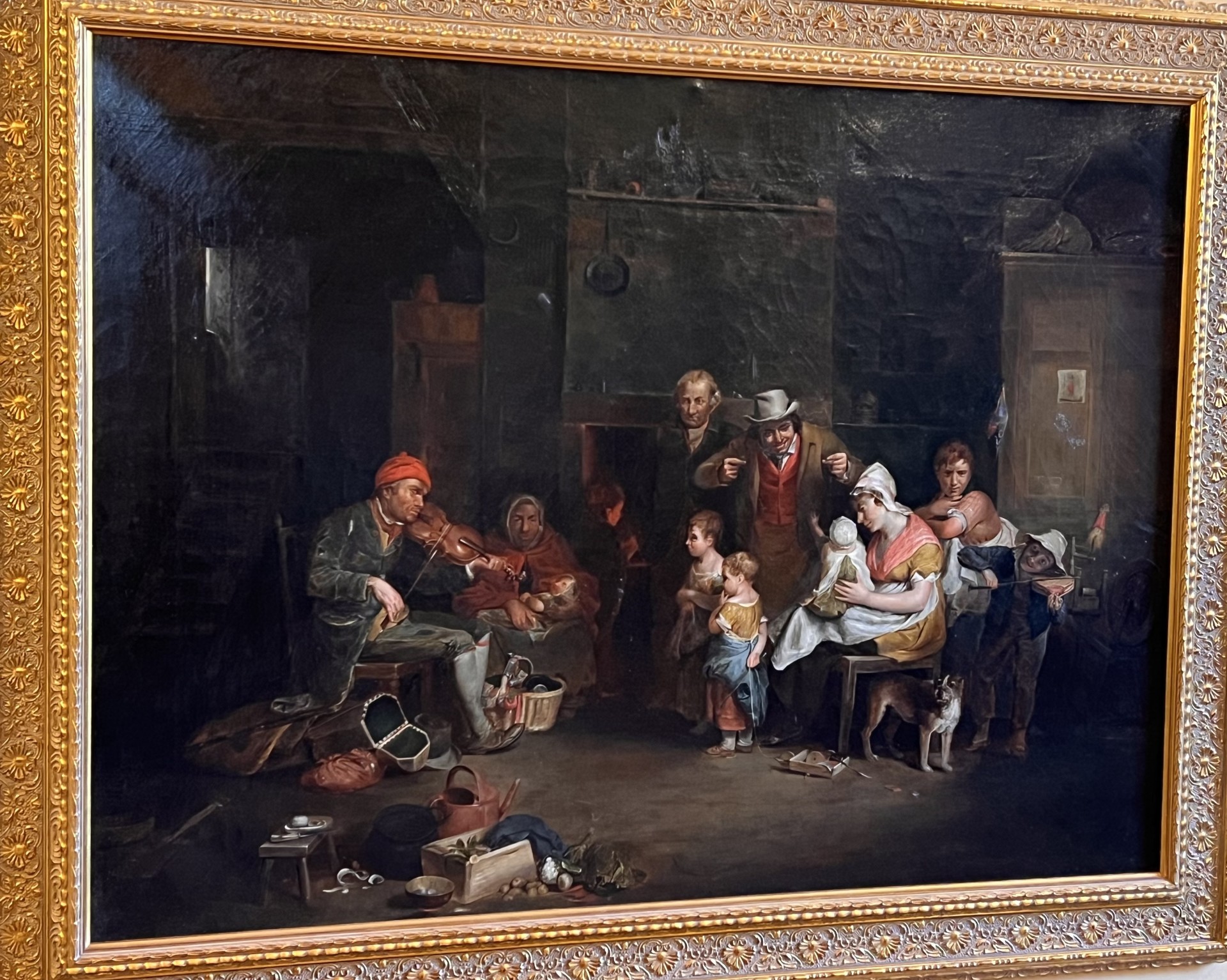 Oil painting copy attributed to Bertram Couldery of The Blind Fiddler by David Wilkie. A blind man playing a fiddle for an audience.