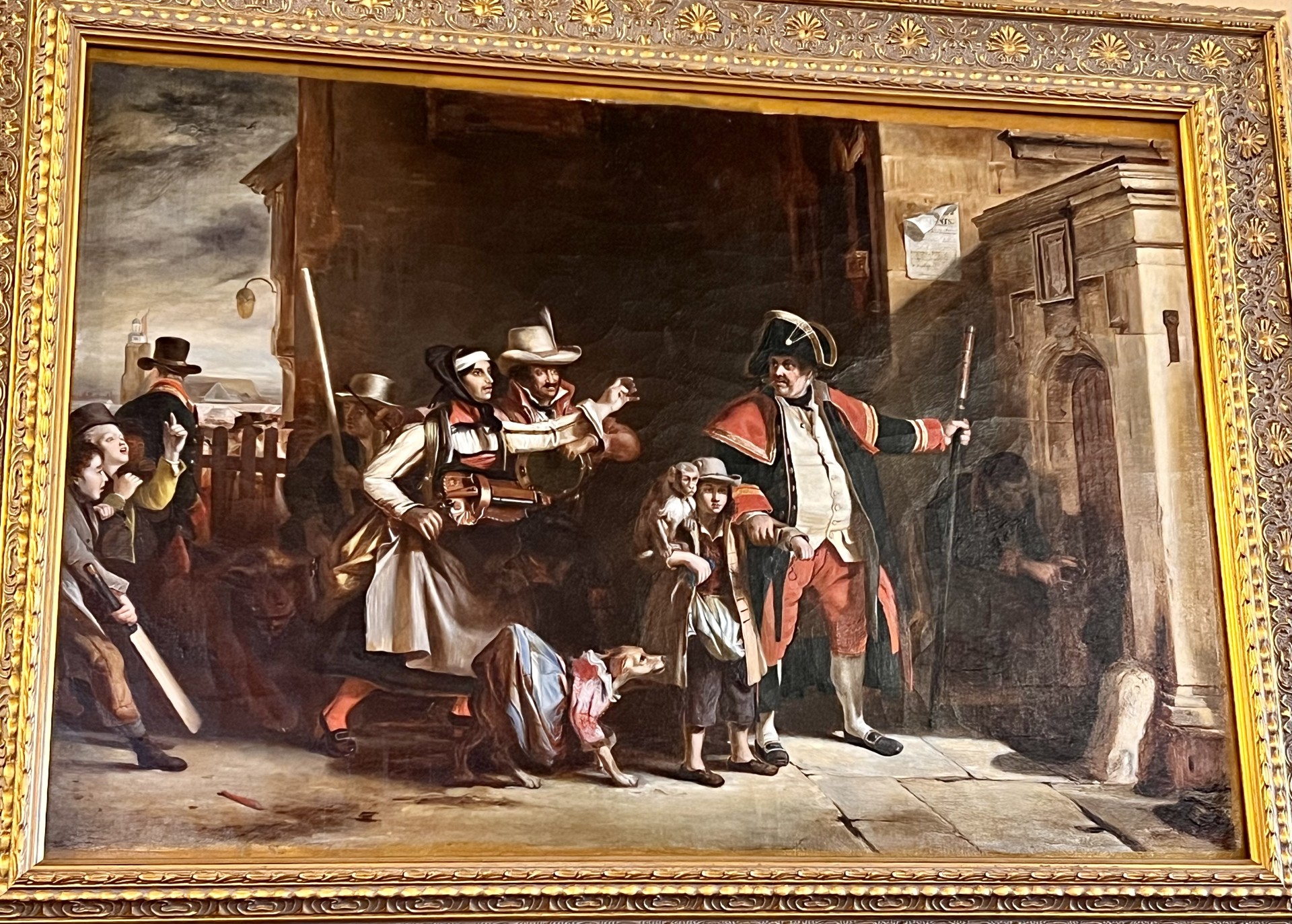 A copy oil painting in a gold frame attributed to Bertram Couldery. Copy of The Parish Beadle by Sir David Wilkie. 